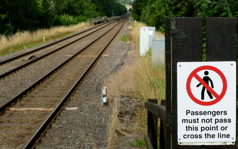 Rail trespass sign on side of tracks